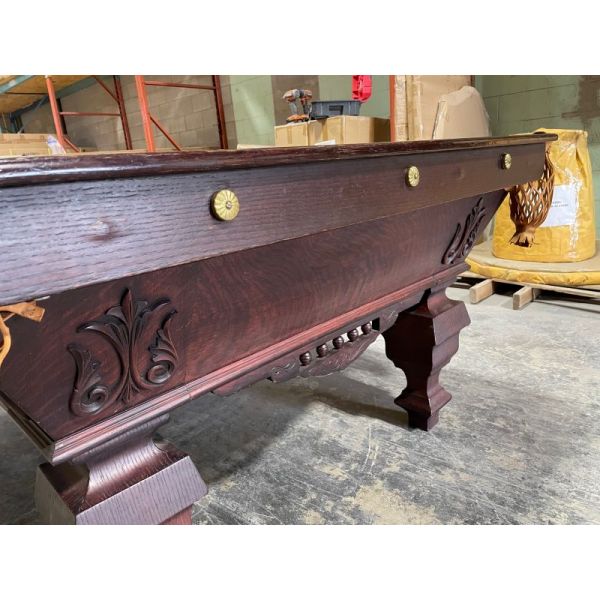Brass rosettes on an extremely rare Antique Brunswick Billiards 9 foot Pool Table from the late 1800's with Mahogany finish, carved details and appliqués