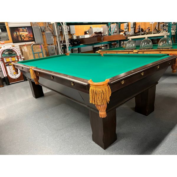 Brunswick Billiard Dominion Antique 9 foot pool table made with hardwood and 1 inch thick natural quarried Slate playing surface, genuine leathe pockets with fridges and Championship Classic Green Teflon protected billiard cloth Code : TABLE190BRU9P  
In