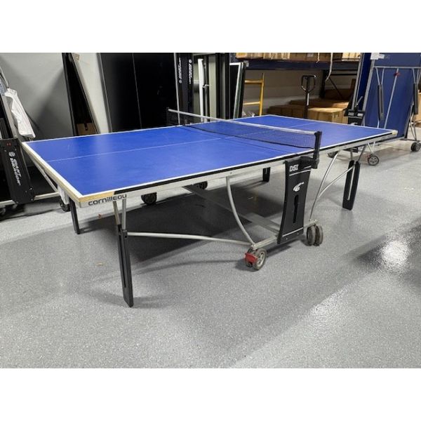 Used Cornilleau Model 250 ping-pong table tennis game on caster wheels Code : GAME084PPTBL 
Wheels are lockable, surfaces are upright foldable for storage or solo play on one side. 
Includes two used paddles, a net and balls.