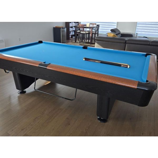 Dufferin Billiards used 9 foot pool table with 1-1/2 natural slate and pedestal legs Code : TABLE504DUF9P
Black and Mahogany Two-Tone finish. Made in Canada with Italian slate, hardwood, engineered woods, new rubber rails and new billiard cloth. Includes