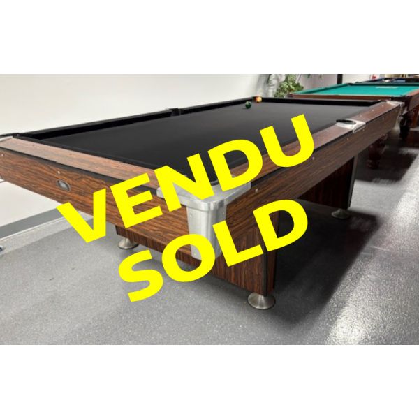 Used OBS Ontario Billiard Supply oversized 8 foot pool table with 1 inch thick slate and pedestal style legs Code: TABLE516OBS8OSP
Made of engineered woods with Arborite/Melamine Rosewood look durable outer laminate and inset pockets. 