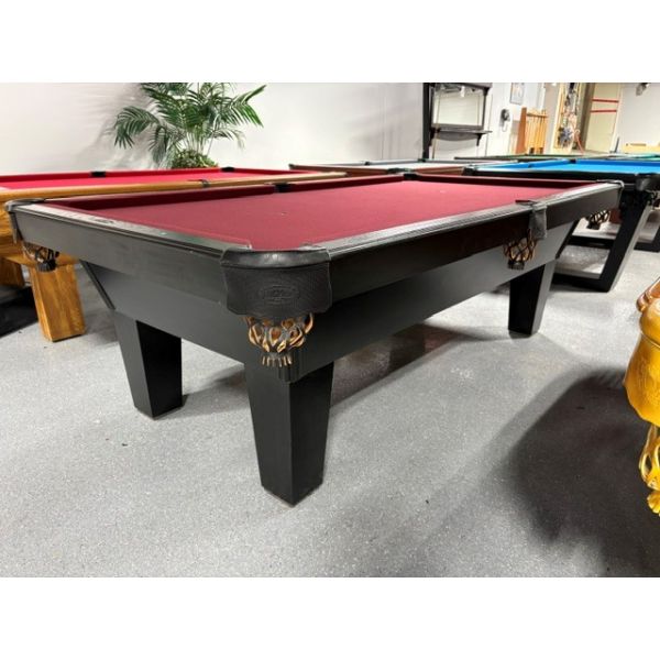 Used 8 foot Olhausen brand Pool Table with 1 inch slate and Wine Red billiard cloth Code : TABLE583-OLH8P
Made with solid hardwood and tapered legs in Black finish, Black genuine leather pockets, natural quarried 1 inch thick slate and Wine Red Champions